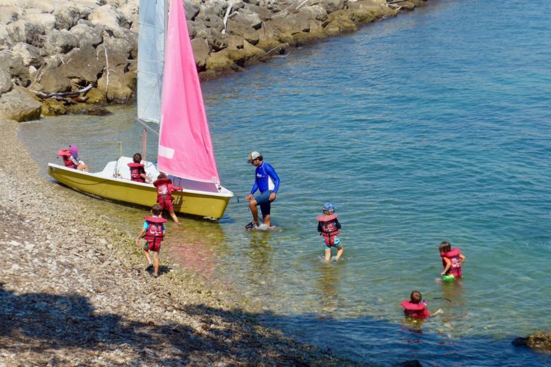 kids camp and sailboat